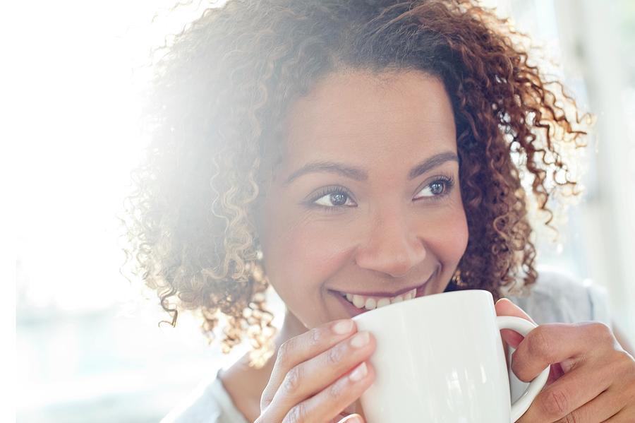 Mid Adult Woman Drinking Coffee Photograph by Science Photo Library ...