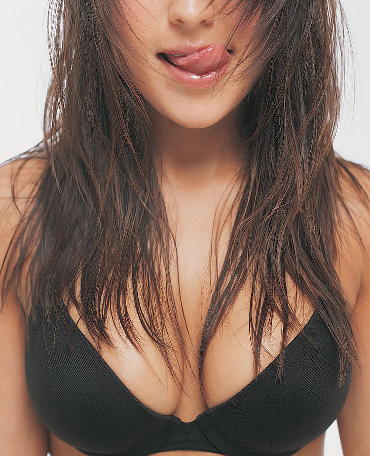 Mid Section View of a Young Woman Wearing a Bra and Licking Her Lips Photograph by Sydney Shaffer