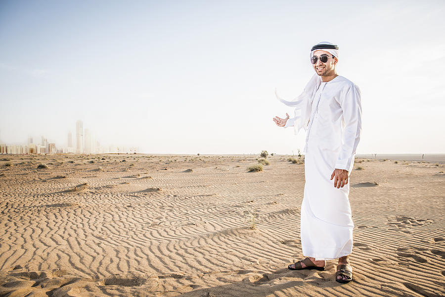 Middle Eastern man standing in desert Photograph by Jacobs Stock Photography Ltd