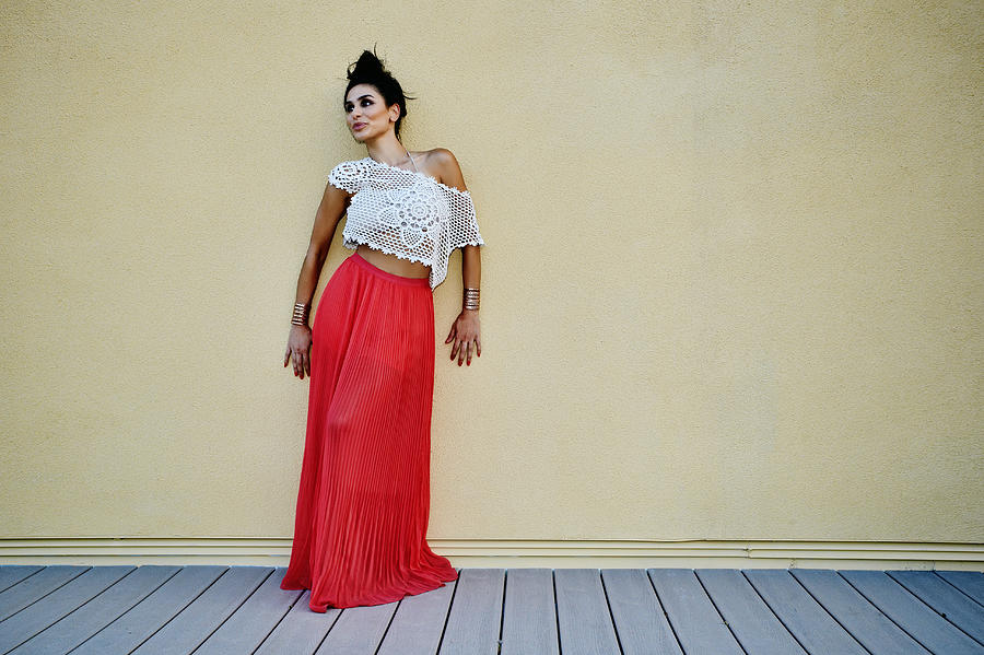 Middle Eastern woman leaning against wall outdoors Photograph by Peathegee Inc Middle Eastern woman leaning against wall outdoors Photograph by Peathegee Inc