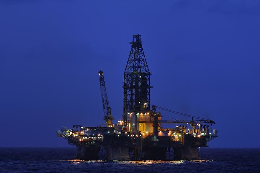 Midnight Offshore at an Oil Rig Photograph by Bradford Martin