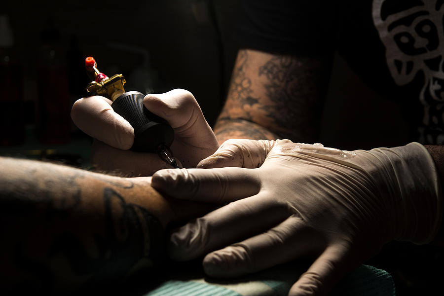 Midsection Of Man Tattooing On Hand Photograph by Andrea Lardani / EyeEm