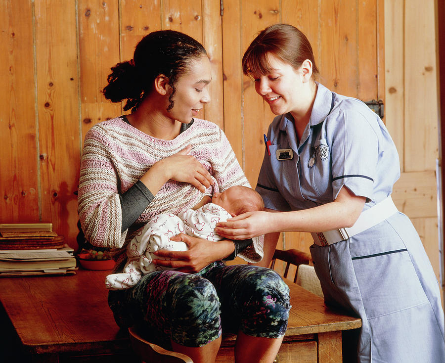 Midwife Helps Mother To Establish Breastfeeding Photograph by Ruth Jenkinson/midirs/science Photo Library
