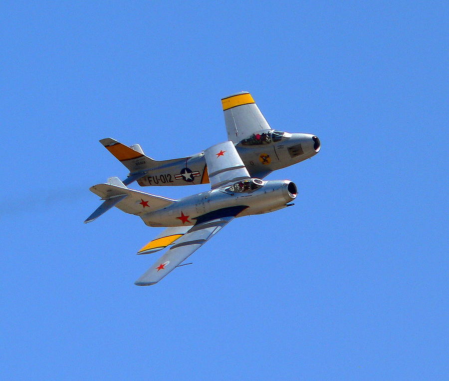 MIG 15 and F86 Sabre Photograph by Jeff Lowe
