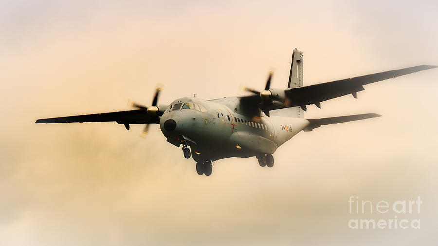Military transport aircraft coming out of the mist Photograph by Nick  Biemans