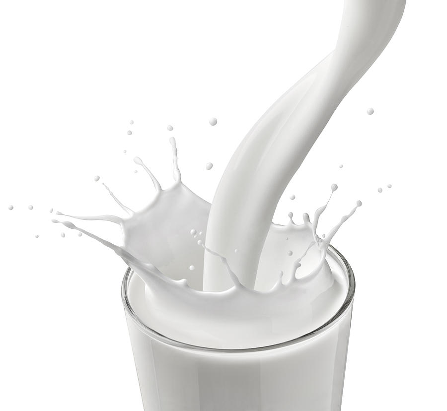Milksplashing in front of white background Photograph by Westend61