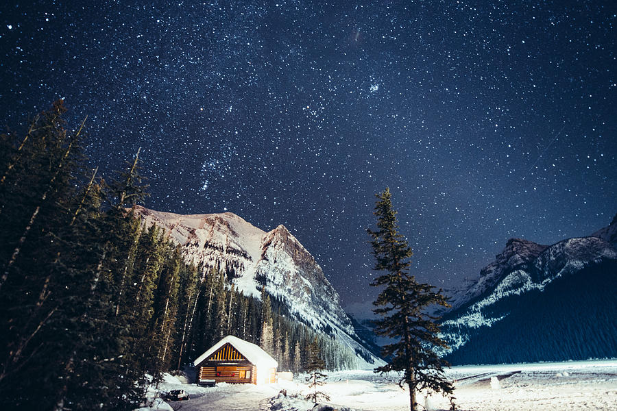 Milky way over Lake Louise in Banff National Park Winter Photograph by Ferrantraite