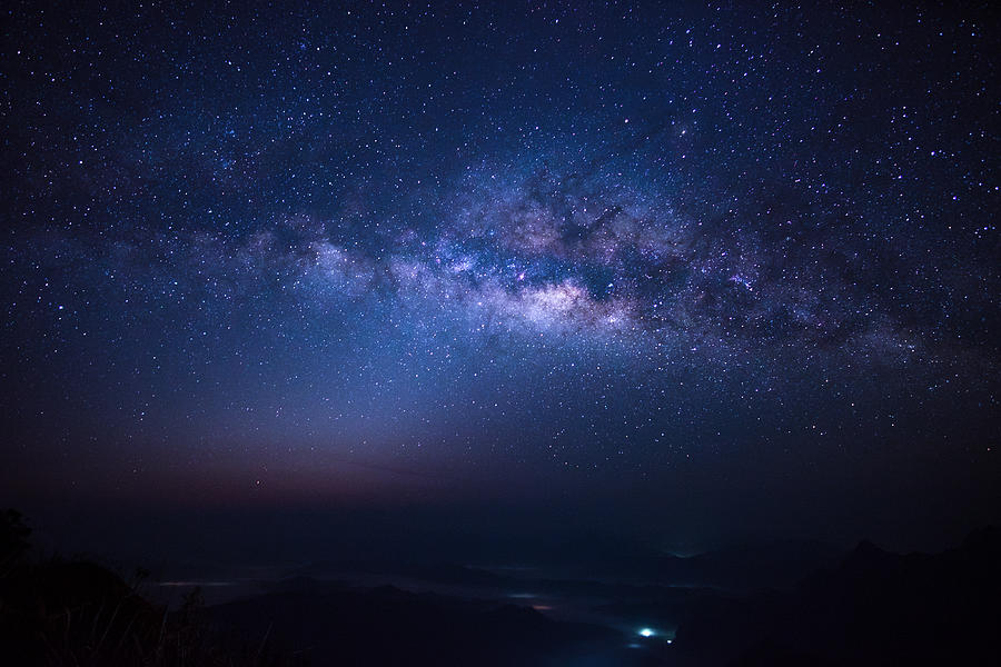 Milky Way over Phu Chi Fa Mountain in Chiang Rai province, Thailand Photograph by Sirintra Pumsopa