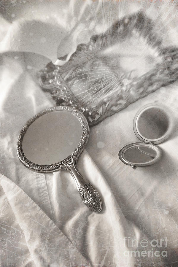 Mirror and other items across unmade bed Photograph by Sandra Cunningham