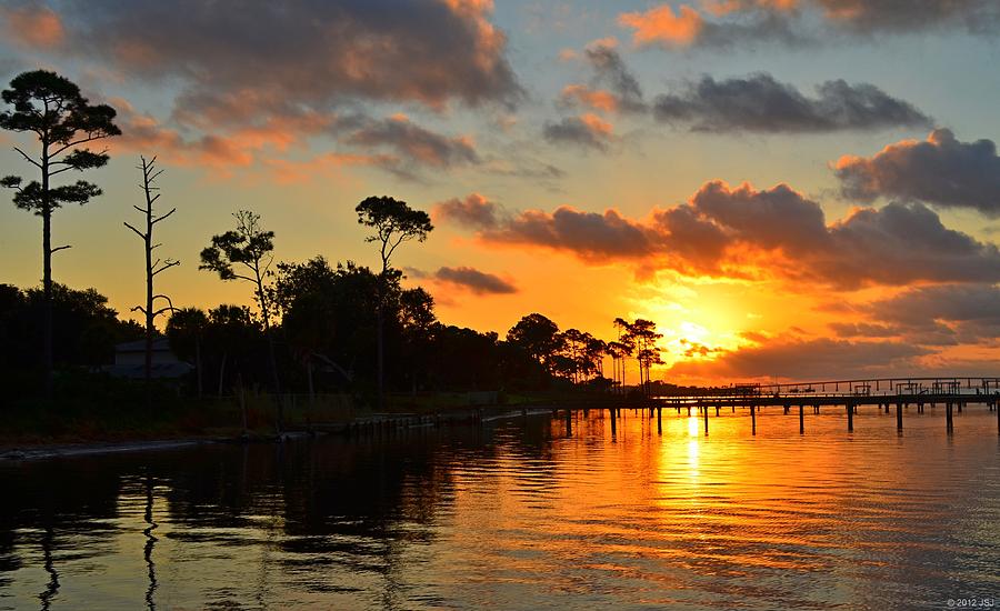 Mirrored Sunrise Colored Clouds and Pine Tree Silhouettes on Calm Santa Rosa Sound Photograph by Jeff at JSJ Photography