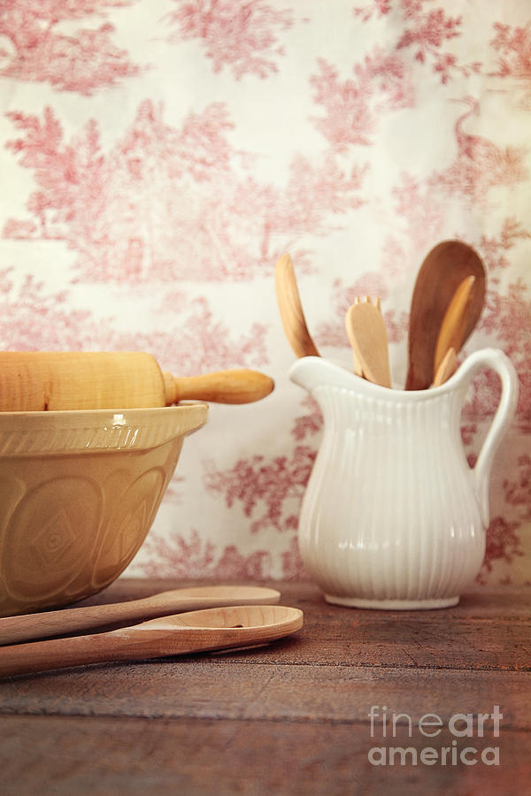 Mixing bowls with rolling pin on wooden table Photograph by Sandra Cunningham