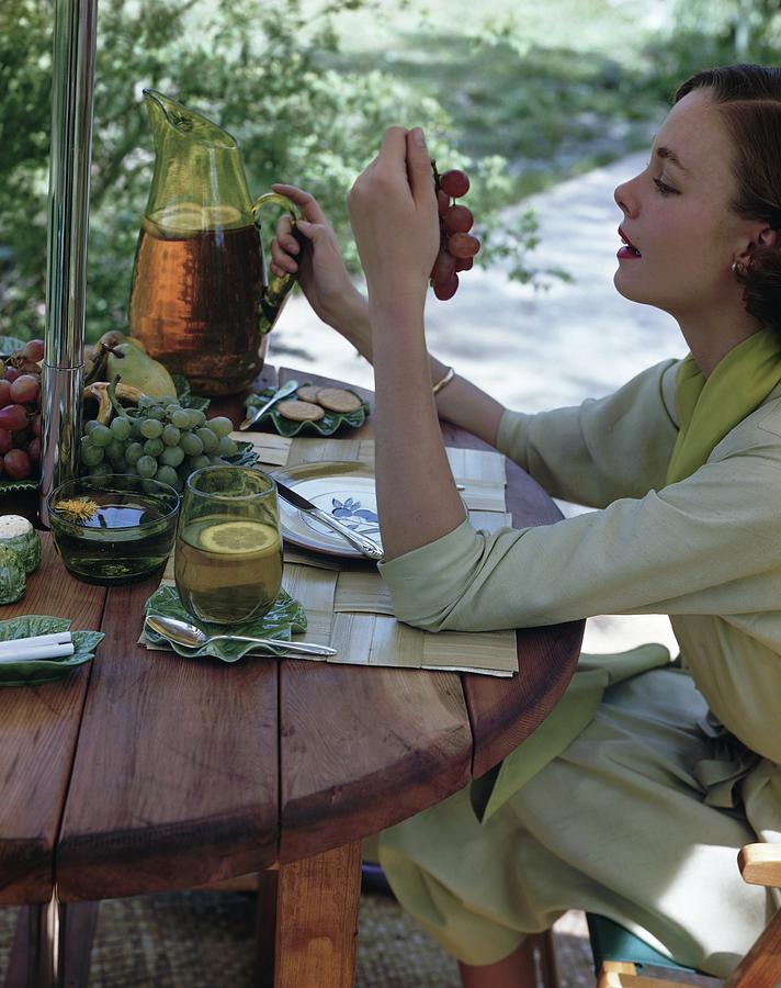 Model At An Outdoor Table Photograph by Horst P. Horst
