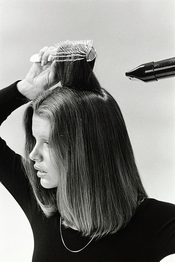 Model Blow Drying Hair Photograph by Mike Reinhardt