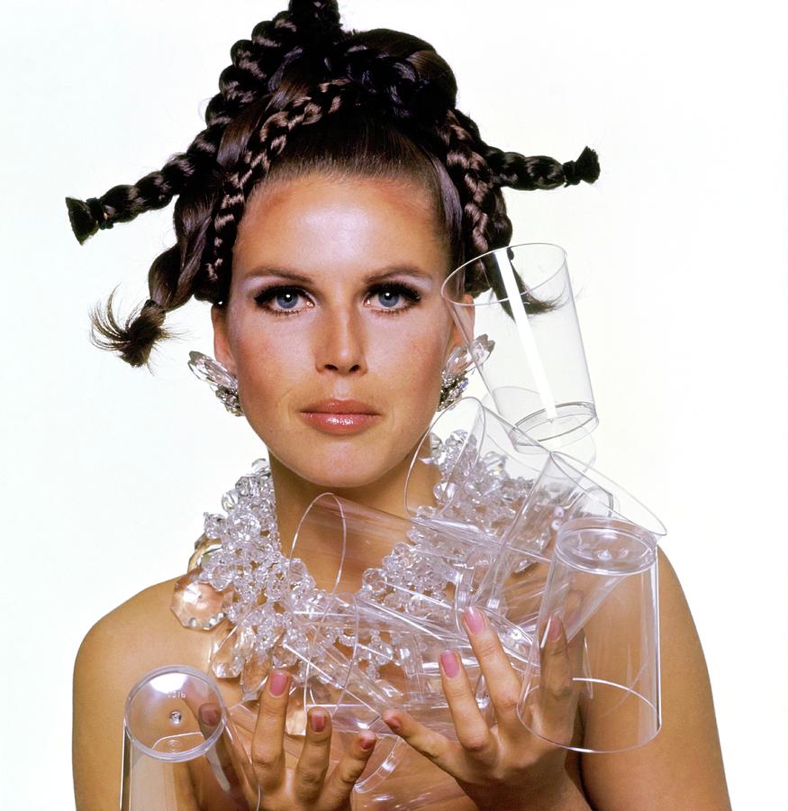 Model Holding Plastic Cups Photograph by Bert Stern