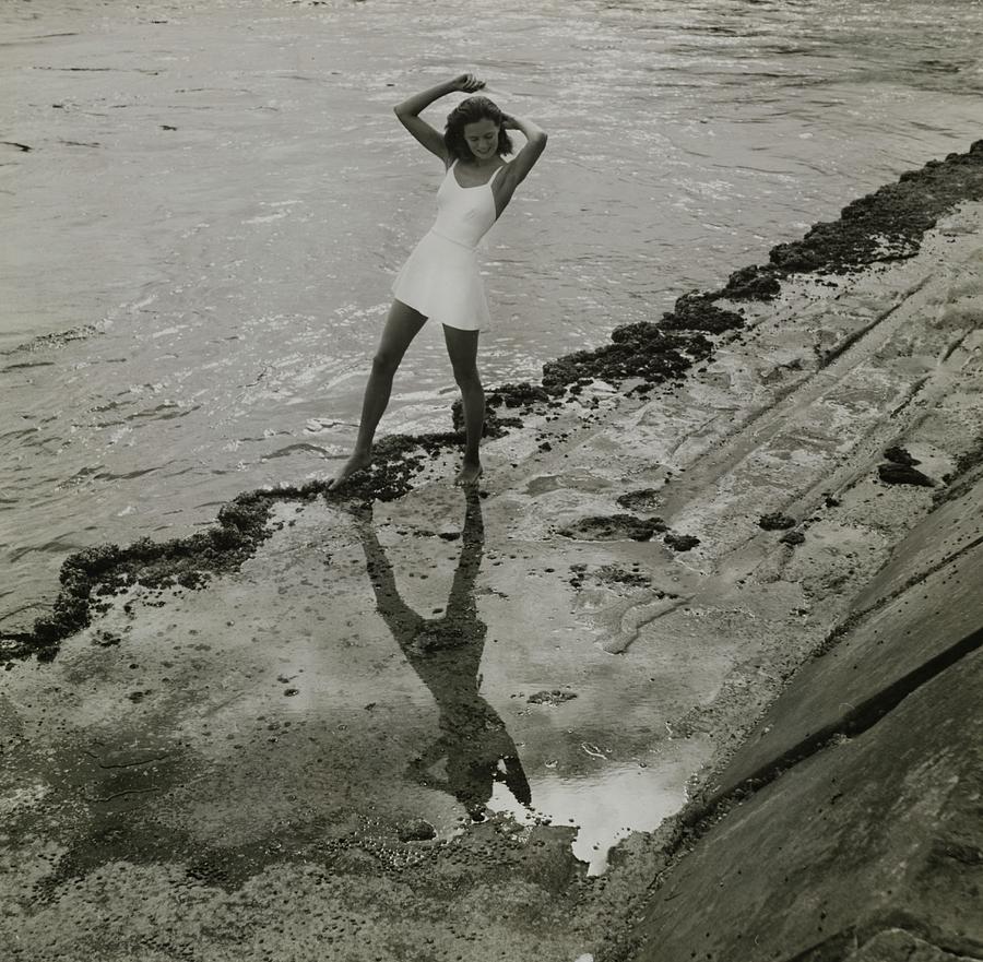 Model In One Piece Swimsuit On Beach Photograph by Toni Frissell