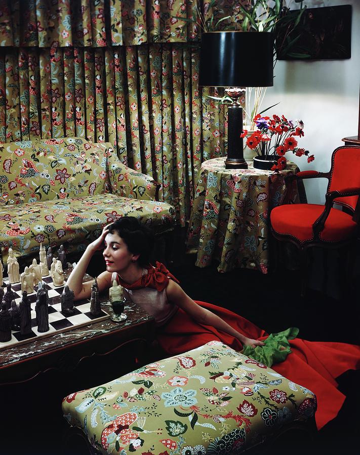 Model Leaning On A Chess Table Photograph by Horst P. Horst