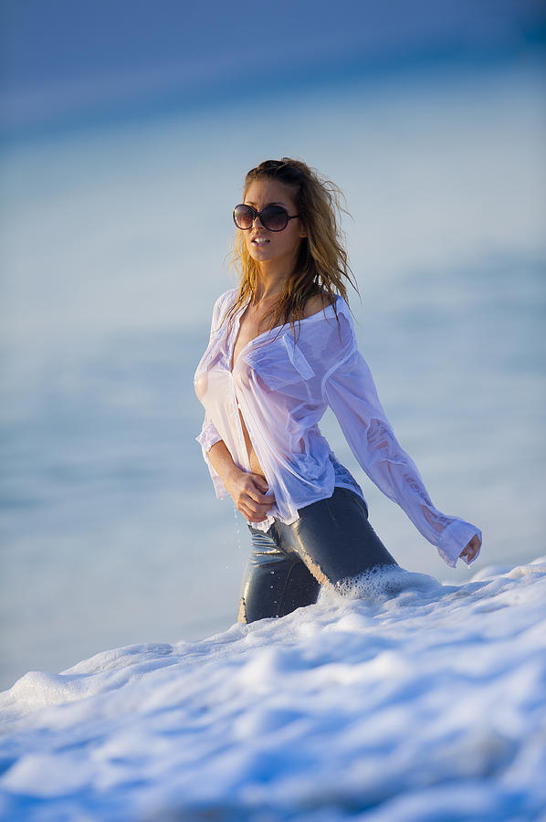 Model on beach with wet clothes Photograph by Juan Hernandez