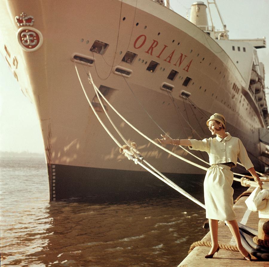 Model Posing Next To The Ship Oriana Photograph by Henry Clarke