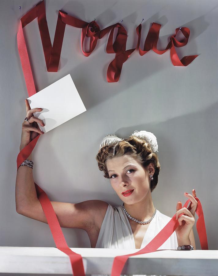 Model Under Vogue Sign Photograph by Horst P. Horst