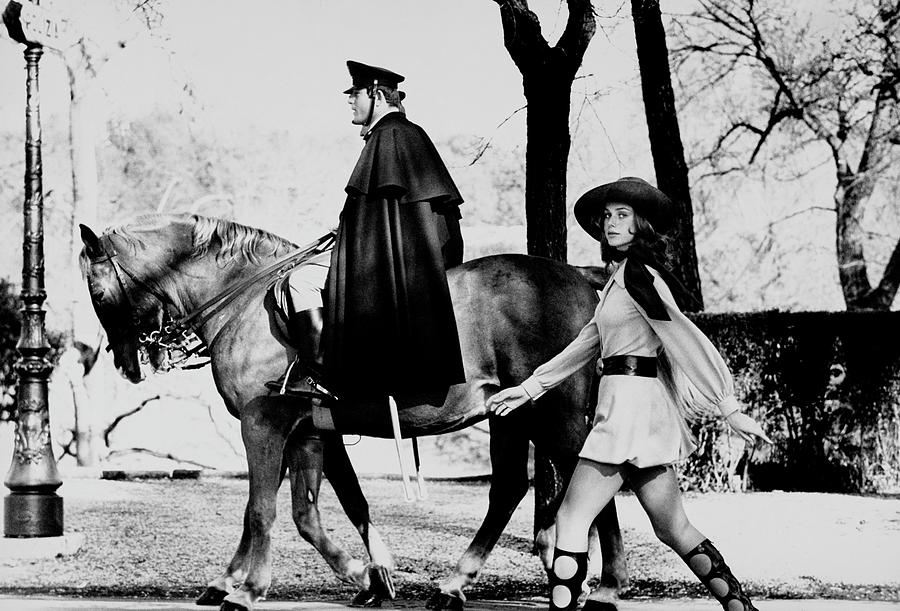 Model Walks Along With A Horse In The Piazza Di Photograph by Henry Clarke