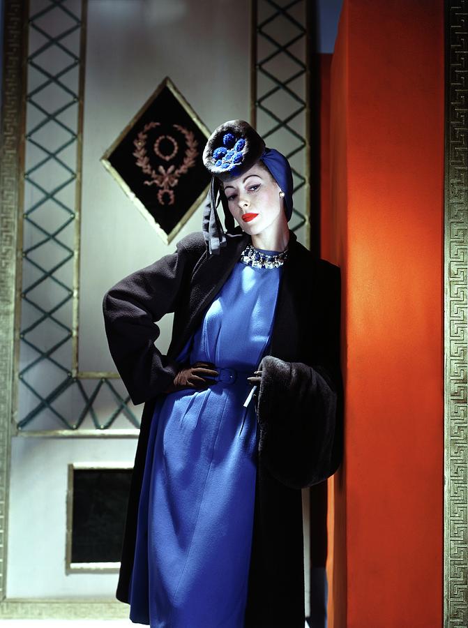 Model Wearing A Black And Blue Outfit Photograph by Horst P. Horst