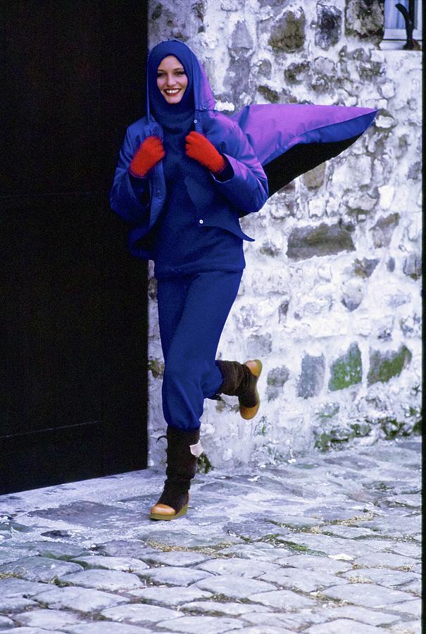 Model Wearing A Blue Raincoat Photograph by Arthur Elgort Model Wearing A Blue Raincoat Photograph by Arthur Elgort
