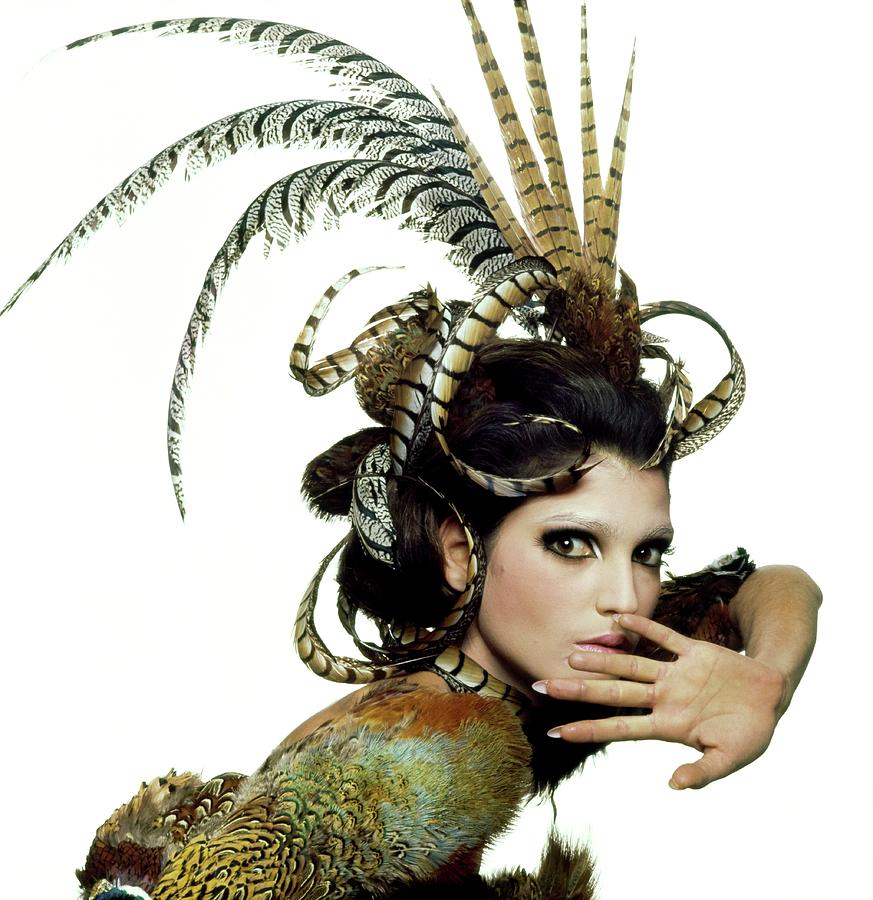 Model Wearing A Feather Headdress Photograph by Bert Stern