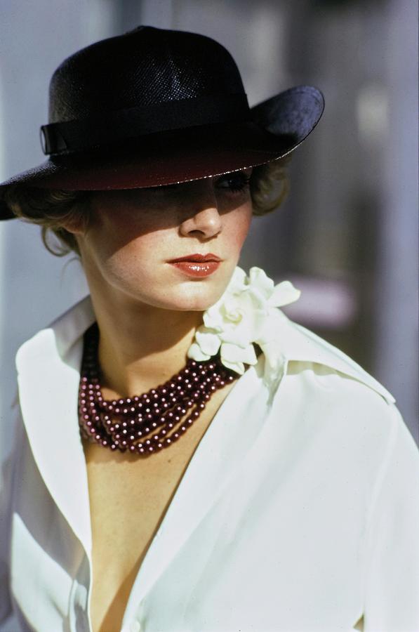 Model Wearing A Hat And Beads Photograph by Arthur Elgort