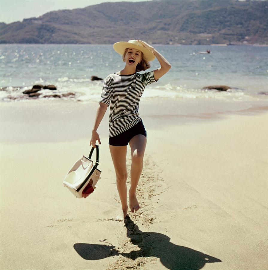 Model Wearing A Straw Hat On A Beach Photograph by Sante Forlano