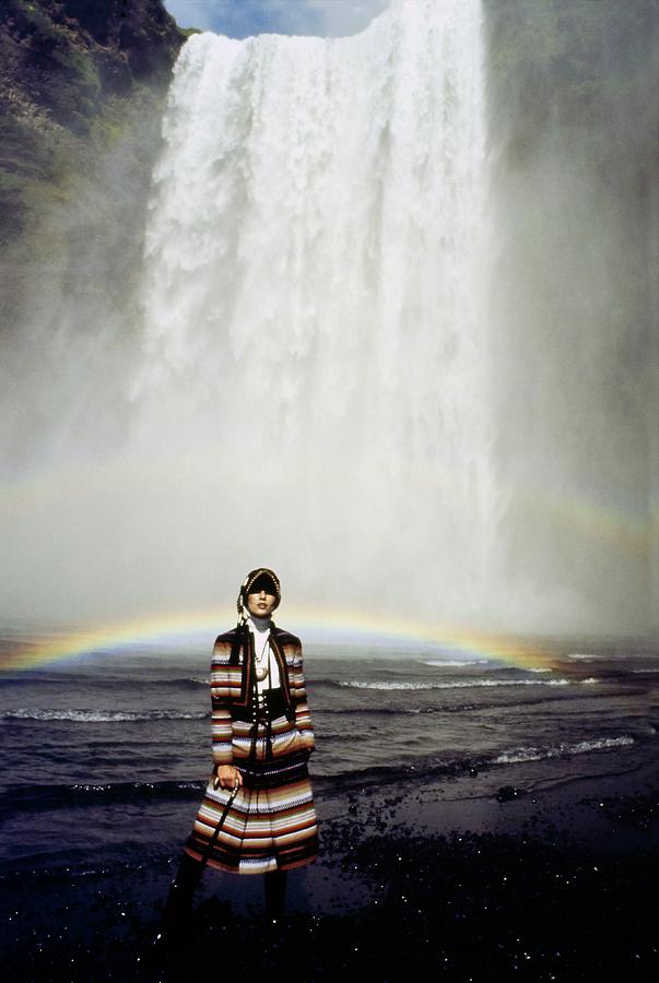 Landscape Photograph - Model By A Waterfall With Rainbow by John Cowan