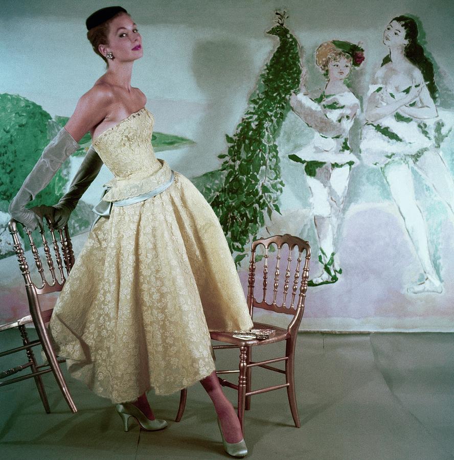 Model Wearing A Yellow Lace Strapless Evening Photograph by Henry Clarke