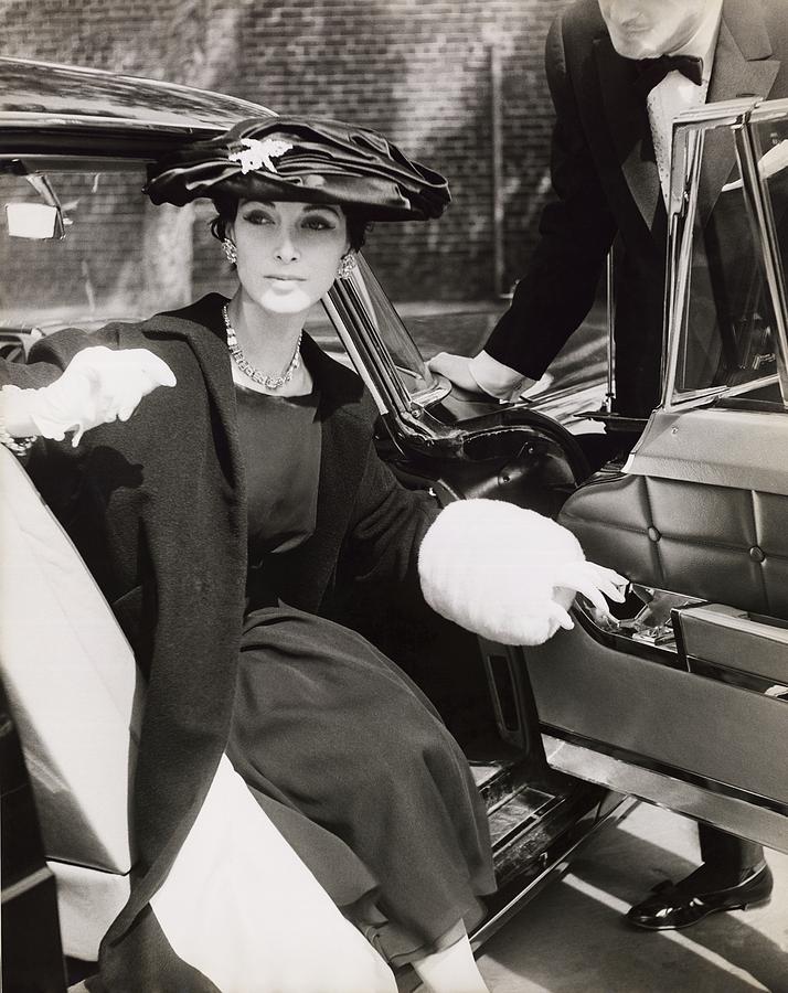Model Wearing Coat And Hat In Car Photograph by Horst P. Horst