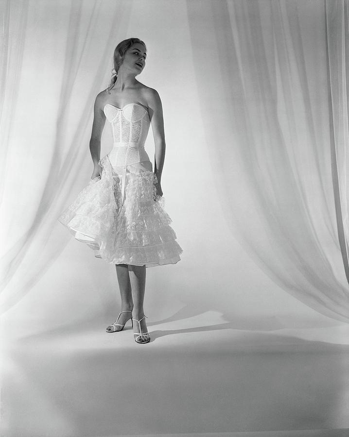 Model Wearing Corset And Petticoat Photograph by Horst P. Horst
