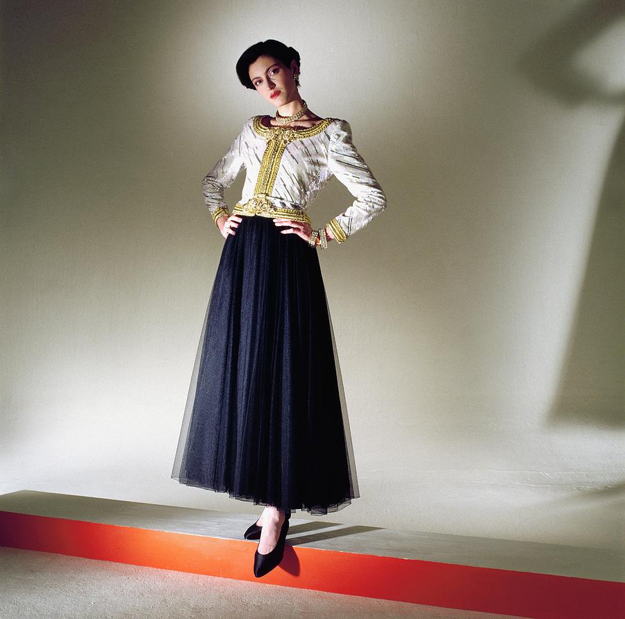 Model Wearing Jacket And Chiffon Skirt Photograph by Horst P. Horst