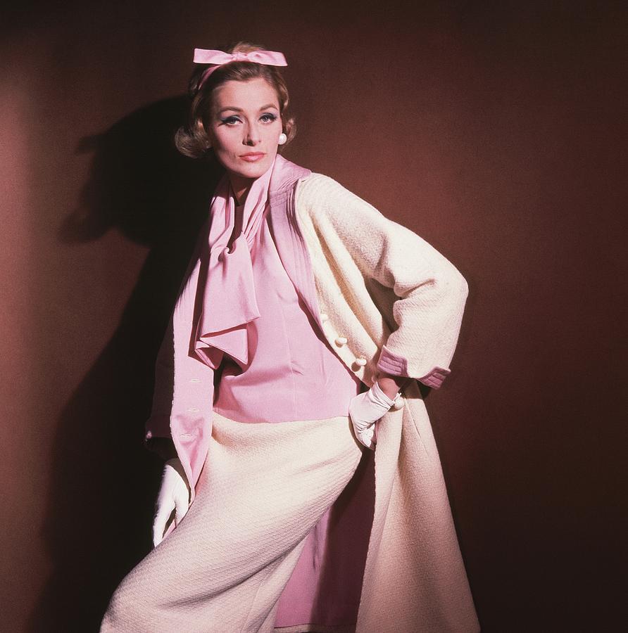 Model Wearing White Coat Over Pink Blouse Photograph by Horst P. Horst
