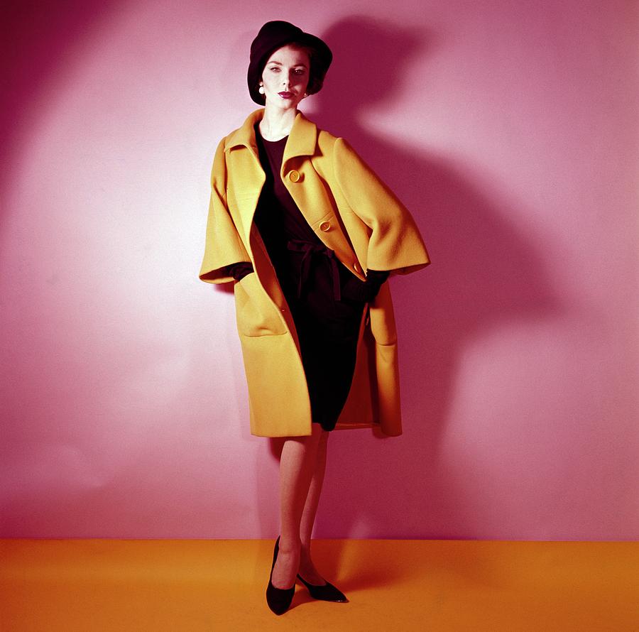 Model Wearing Yellow Coat By Norman Norell Photograph by Horst P. Horst