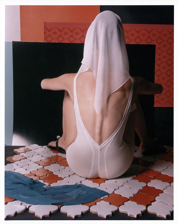 Model With Scarf Over Her Head Wearing Bodysuit Photograph by Horst P. Horst