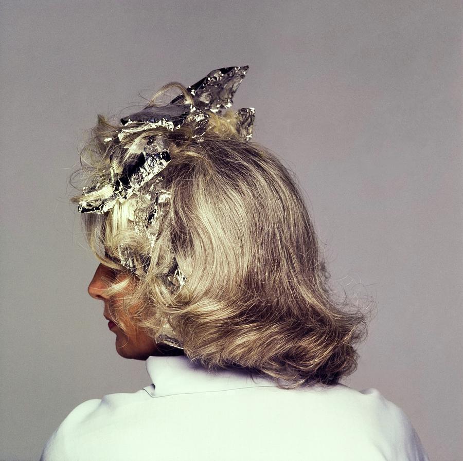 Model With Tin Foil Wraps In Hair Photograph by Francesco Scavullo
