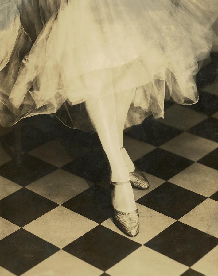 Models Legs Standing On A Checked Floor Photograph by Edward Steichen