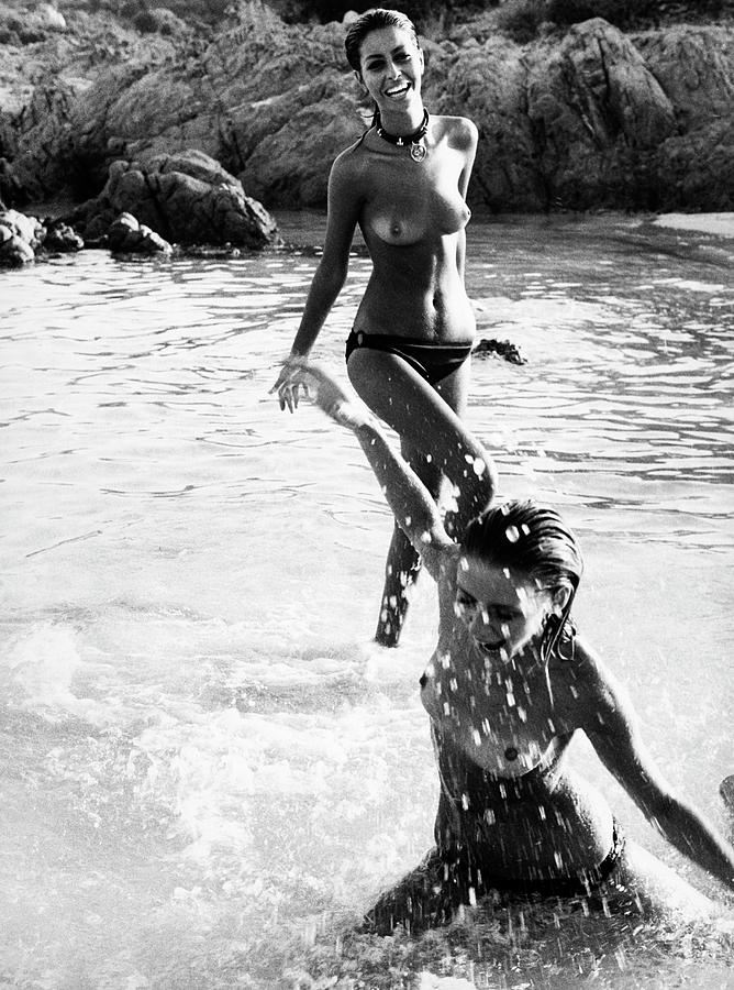 Models Splashing In Water Wearing A Monokini by Elisabetta Catalano.
