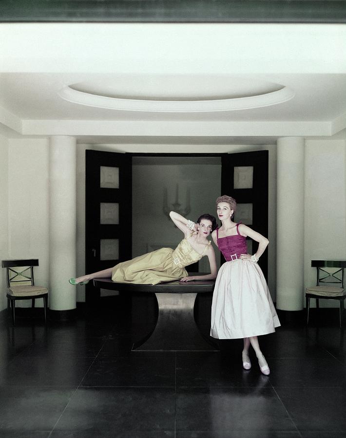 Models Wearing Dresses Photograph by John Rawlings