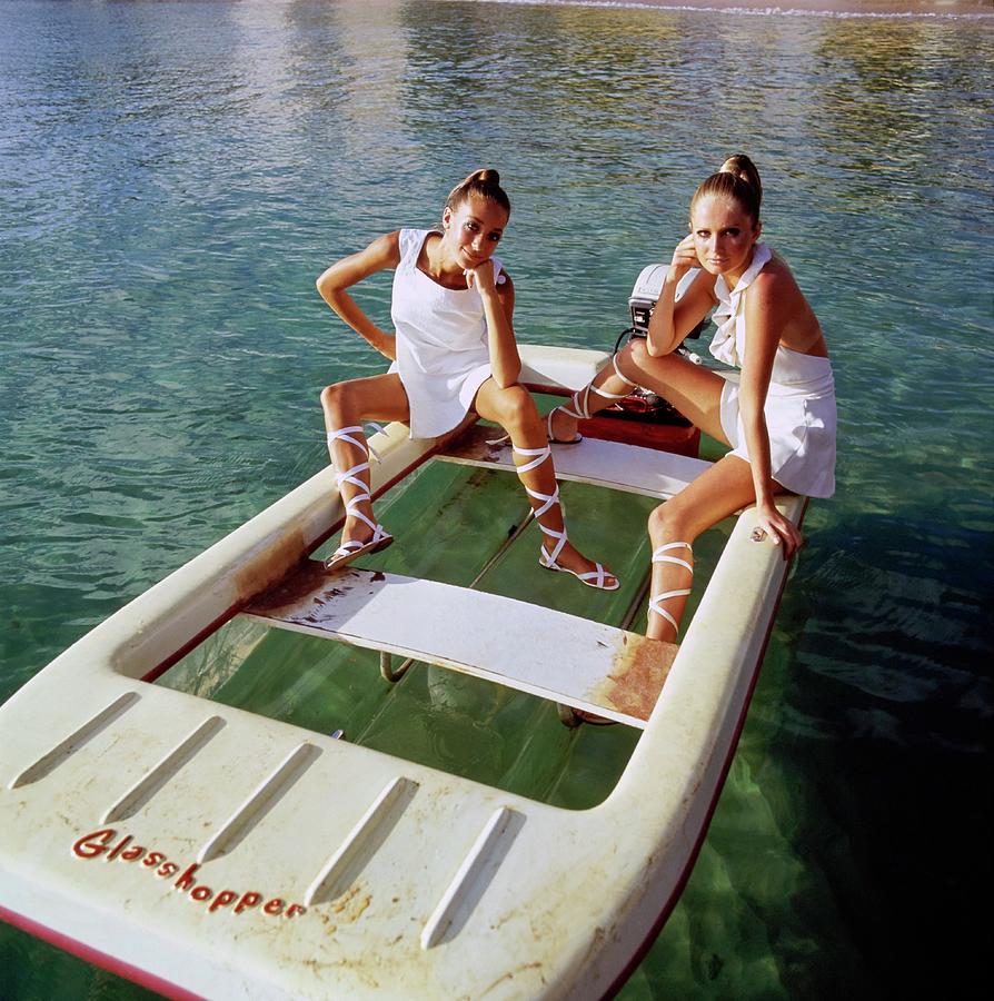 Models Wearing White Dresses On A Motorboat Photograph by Arnaud de Rosnay