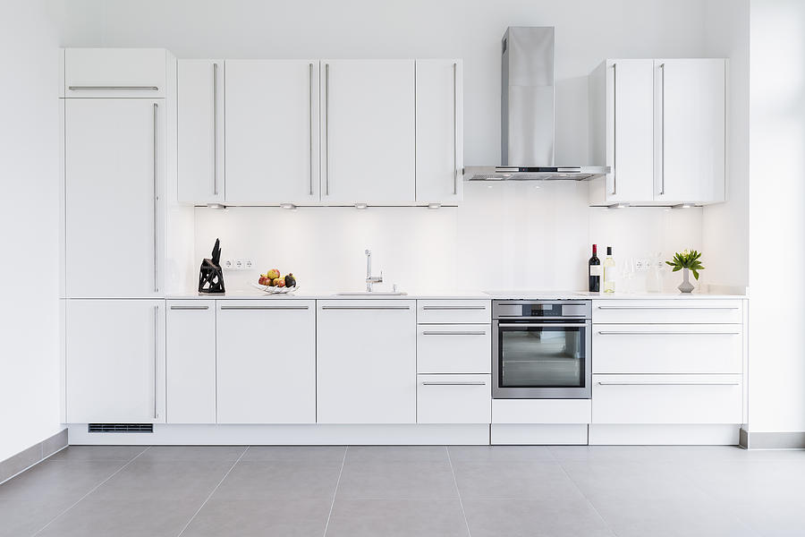 Modern kitchen design with white cabinets Photograph by Sebastian Doerken