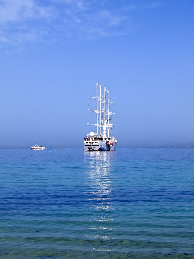 Modern schooner off Mykonos Photograph by Brenda Kean