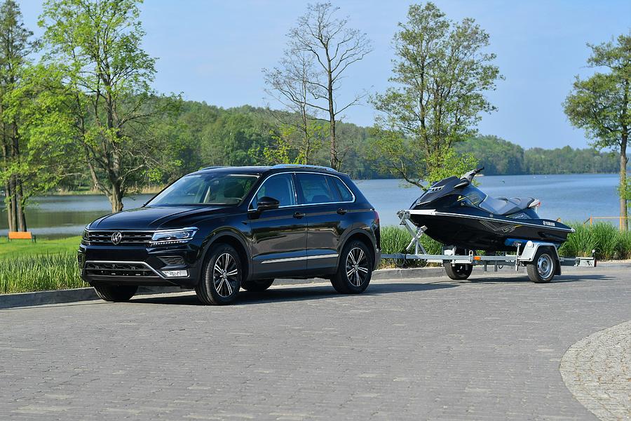 Modern SUV with trailer and jet ski Photograph by Tramino