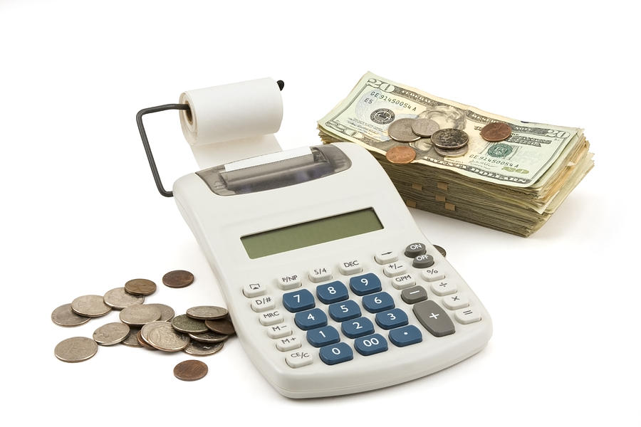 Money and Calculator on white Background Photograph by Keith Webber Jr