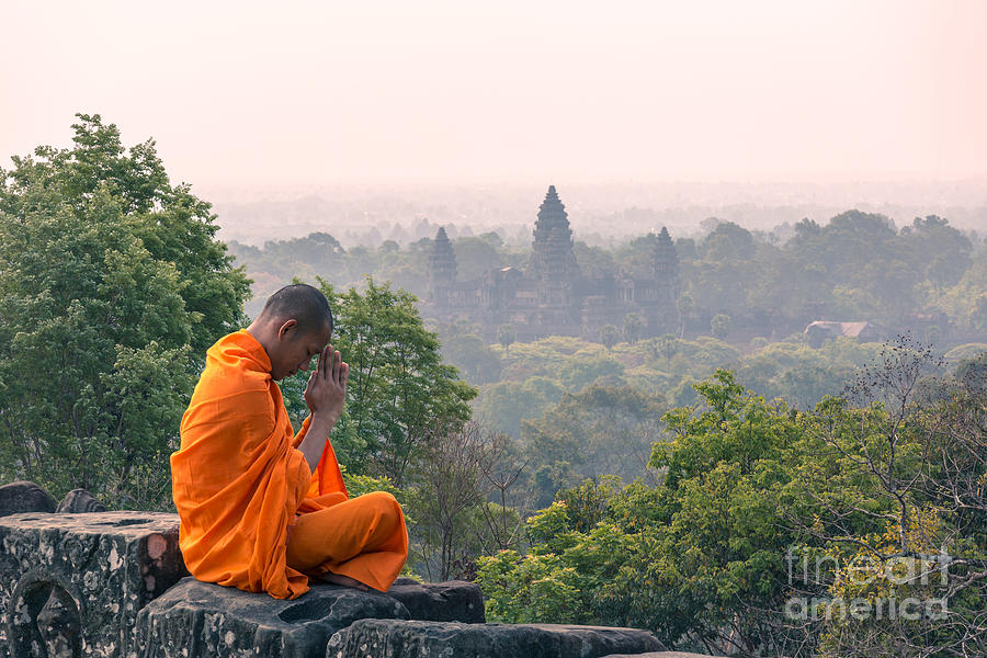 Monk meditating at Angkor wat temple- Cambodia Photograph by Matteo Colombo