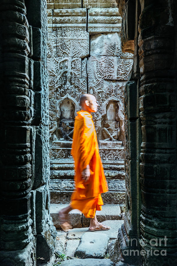 Monk walking inside Angkor Wat temples - Cambodia Photograph by Matteo Colombo