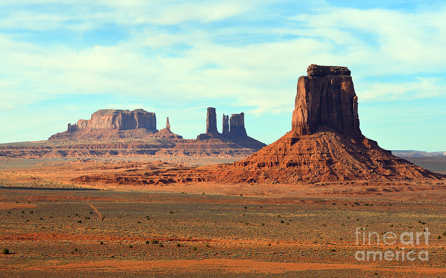 Monument Valley Arizona Red Sandstone Monoliths Rising Up Above Desert Floor Photograph by Shawn OBrien