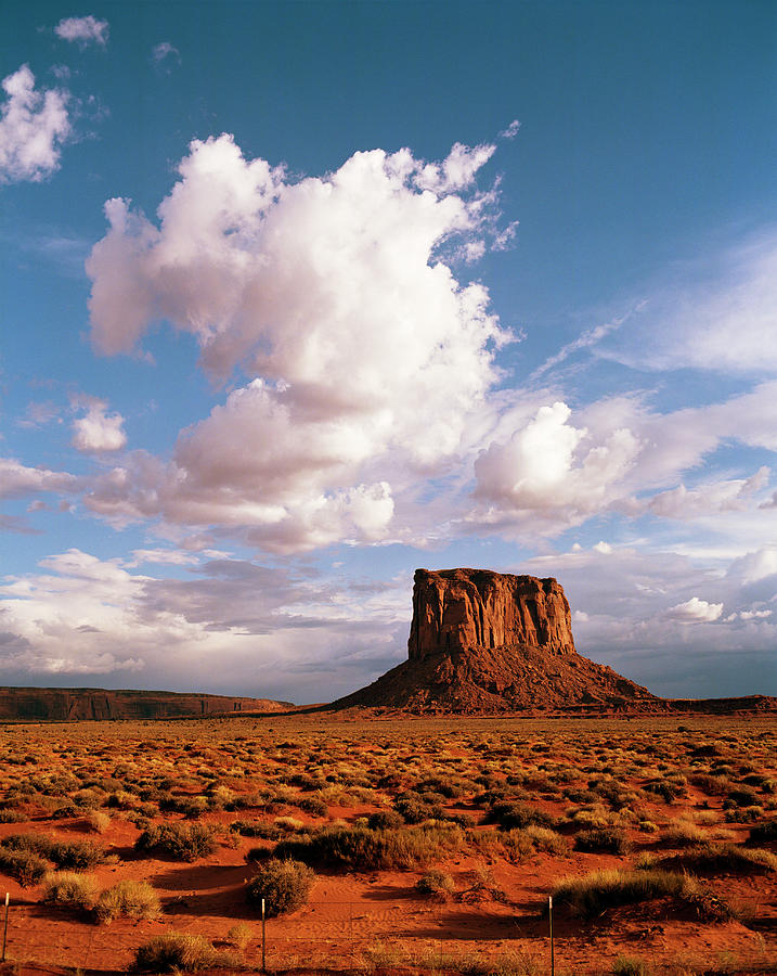 Monument Valley Butte With Storm Clouds Photograph by Gary Yeowell